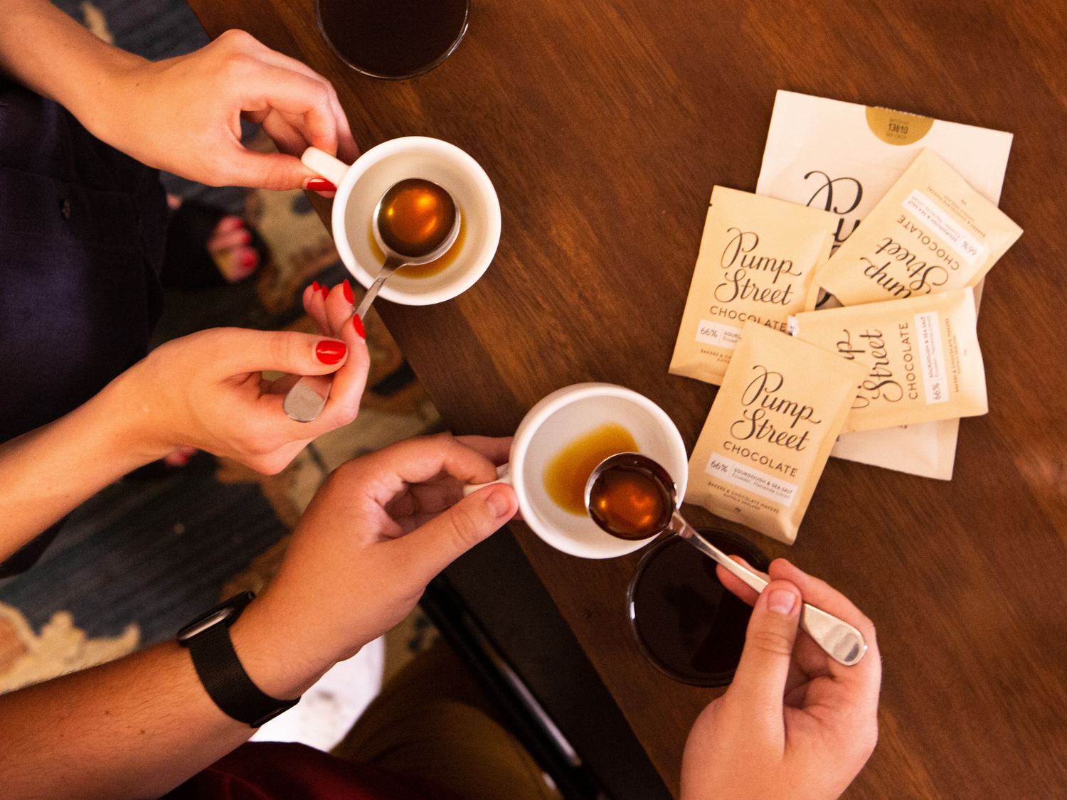 Coffee tasted with spoons and chocolate